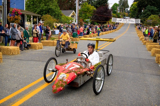 Whimsical Barrels, Boats and Pontoons Speed, Once Again, Down Langley’s First Street